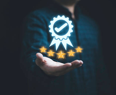 Reliability badge held in hand